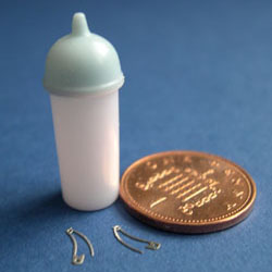 Blue Baby bottle with 2 Nappy pins